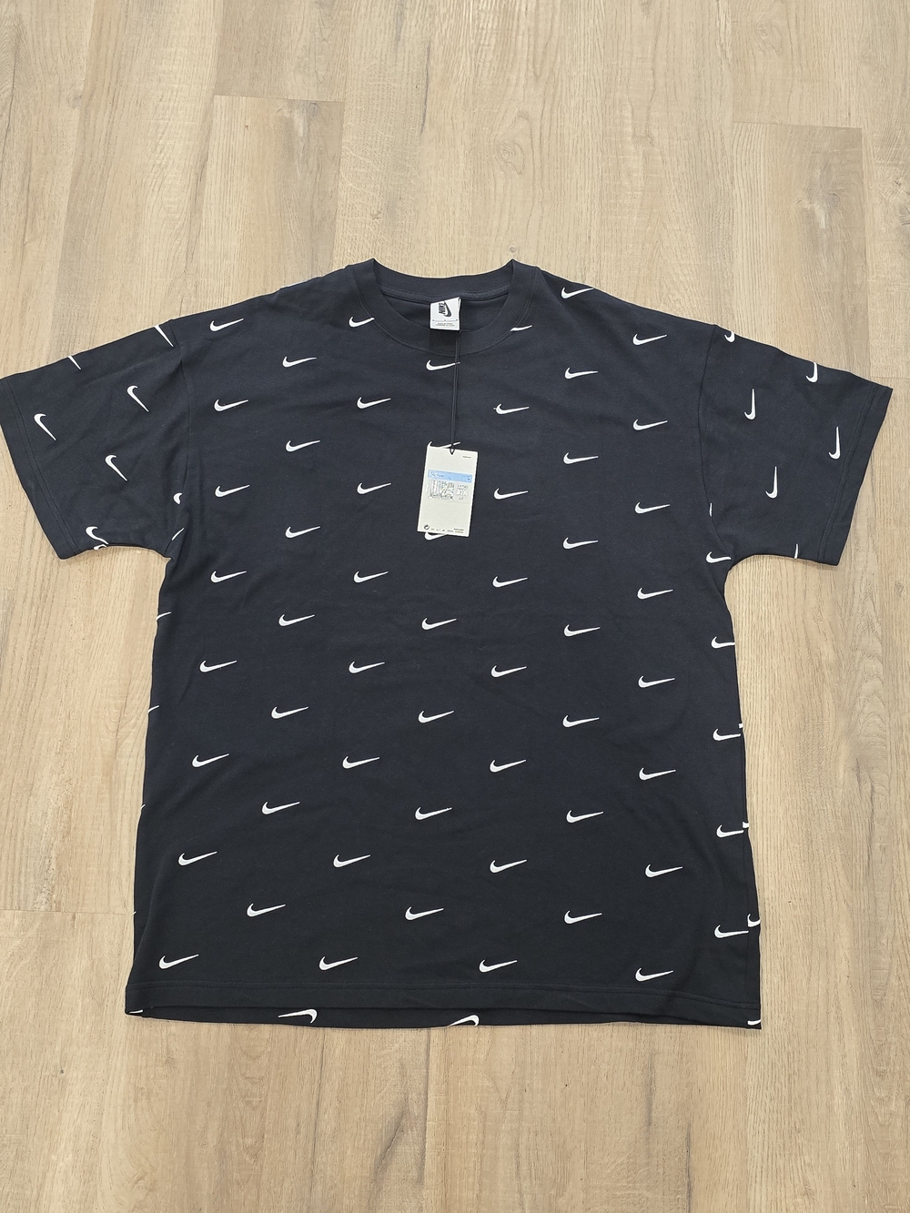 Nike Black Short-Sleeve Tee with Allover White Swoosh Print